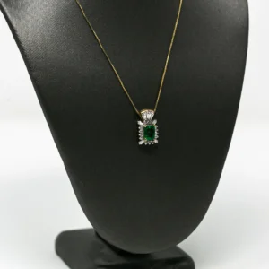 Emerald Cut With Diamond Halo in Yellow Gold