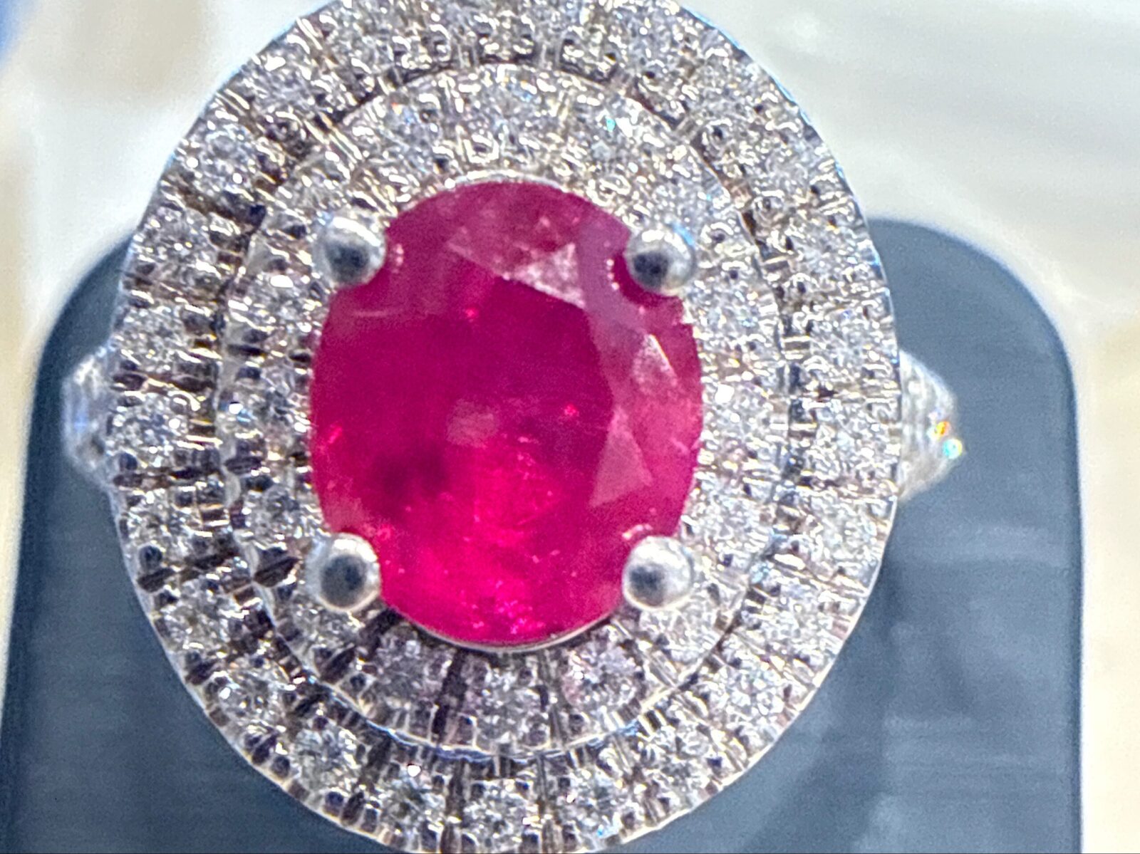 Oval Ruby With Double Diamond Halo In White Gold