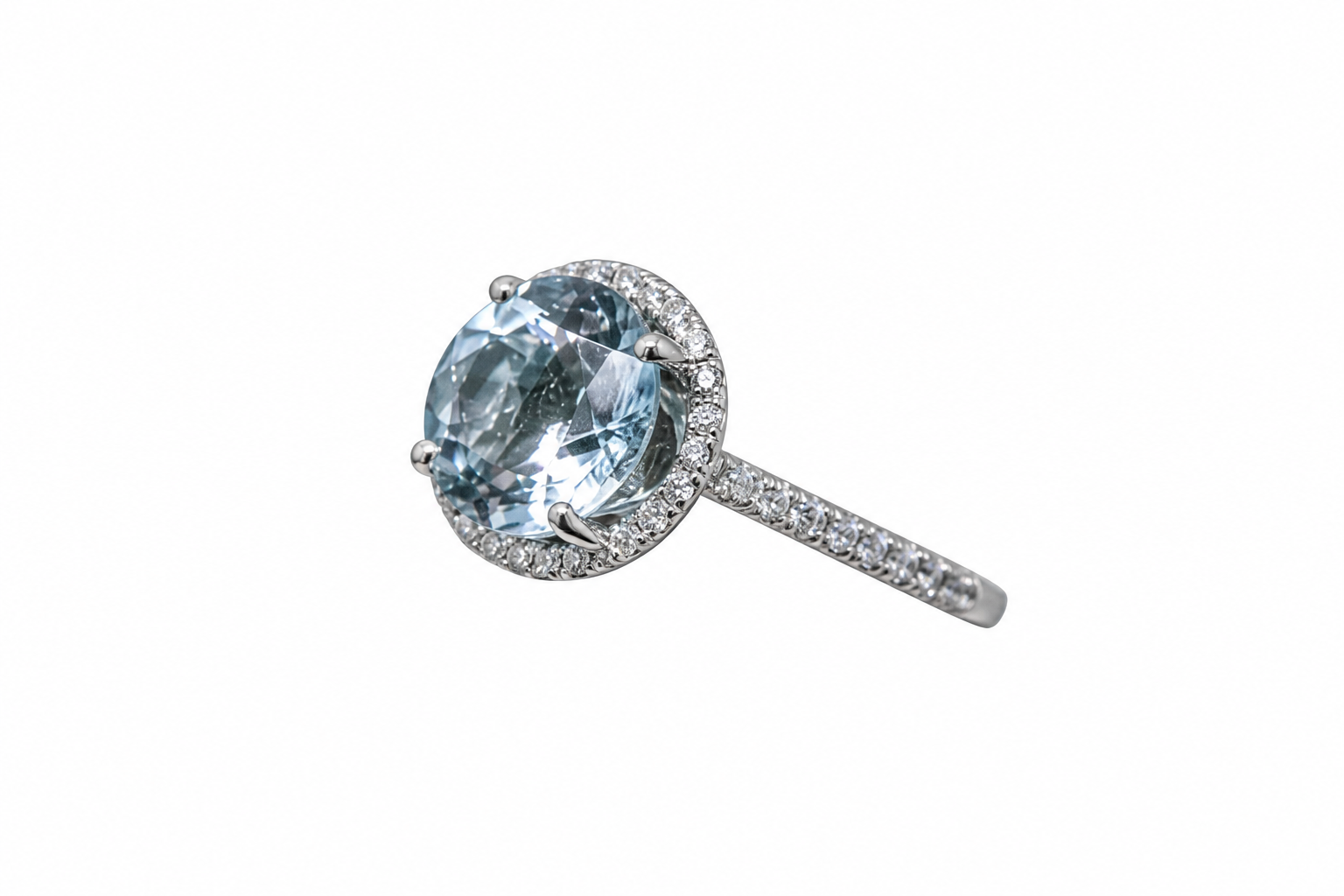 Oval aquamarine ring with diamond halo and diamond shoulders on white