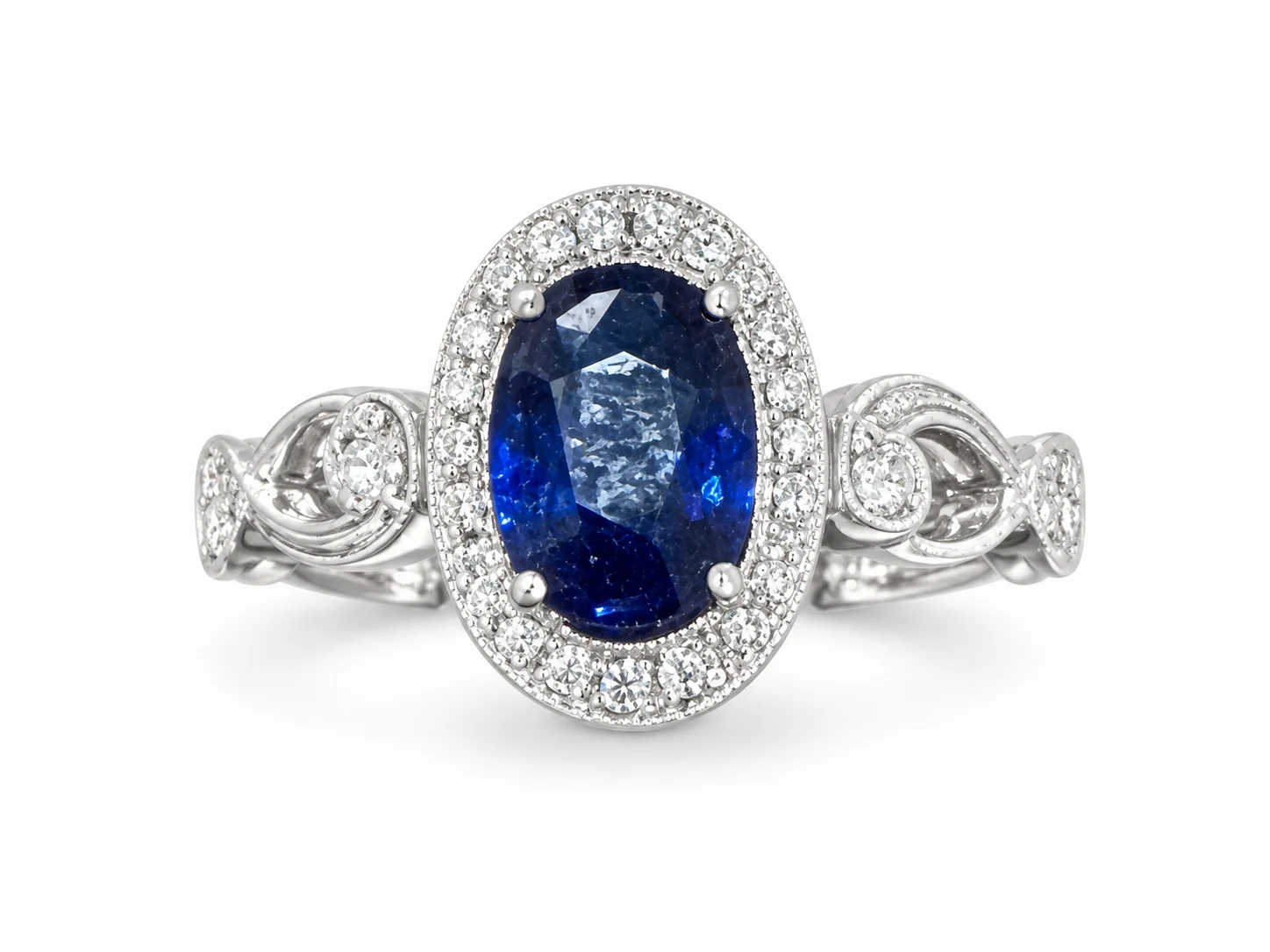 Oval Blue Sapphire With Diamond Halo In White Gold